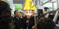 省委常委、农工委主任李昌平等省市和各地市州政府领导在万春展位前，听取万春工作人员介绍养猪设备